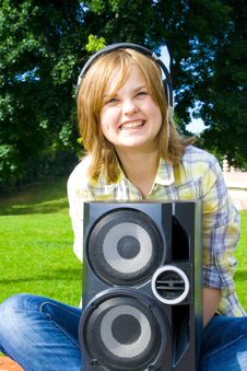 The Young Attractive Girl With Headphones Stock Photography The Young Attractive Girl With Headphones Stock Photography