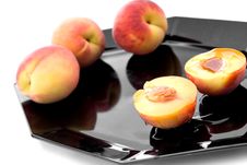 Fresh Peaches With Syrup On A Black Plate Royalty Free Stock Photos Fresh Peaches With Syrup On A Black Plate Royalty Free Stock Photos