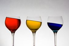 Wineglasses With Colored Liquid At Odd Angle Royalty Free Stock Photography