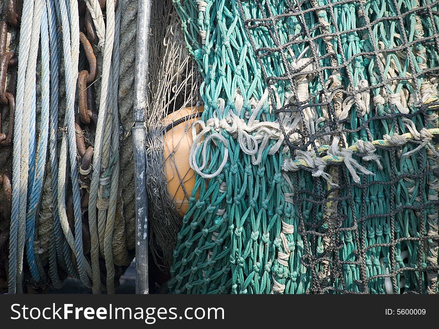 A buoy, net and ropes. A buoy, net and ropes