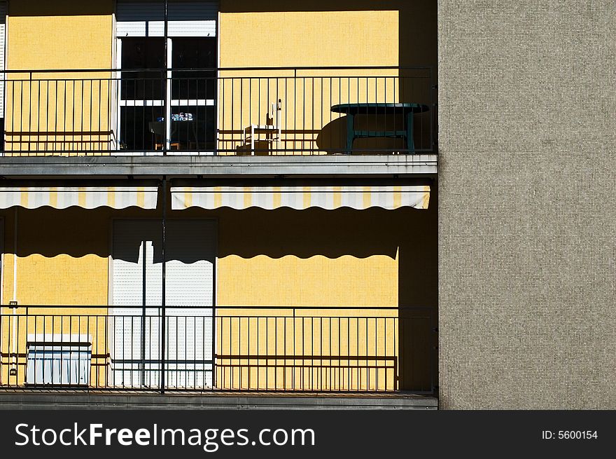 Two rows of balconies in the sun