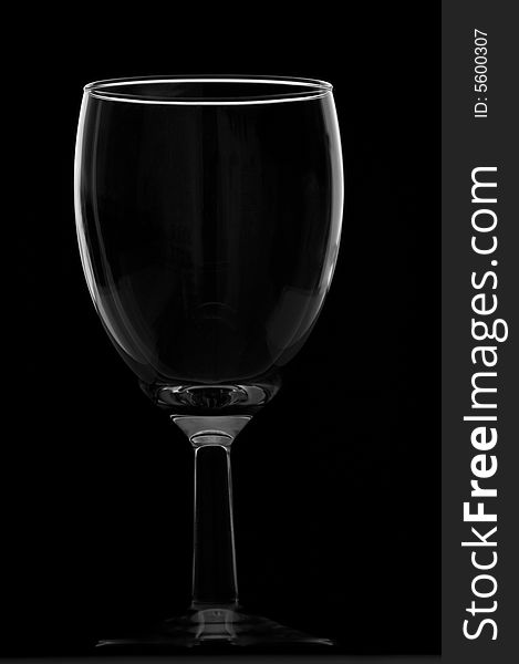 Short empty wine glass isolated on black. Short empty wine glass isolated on black