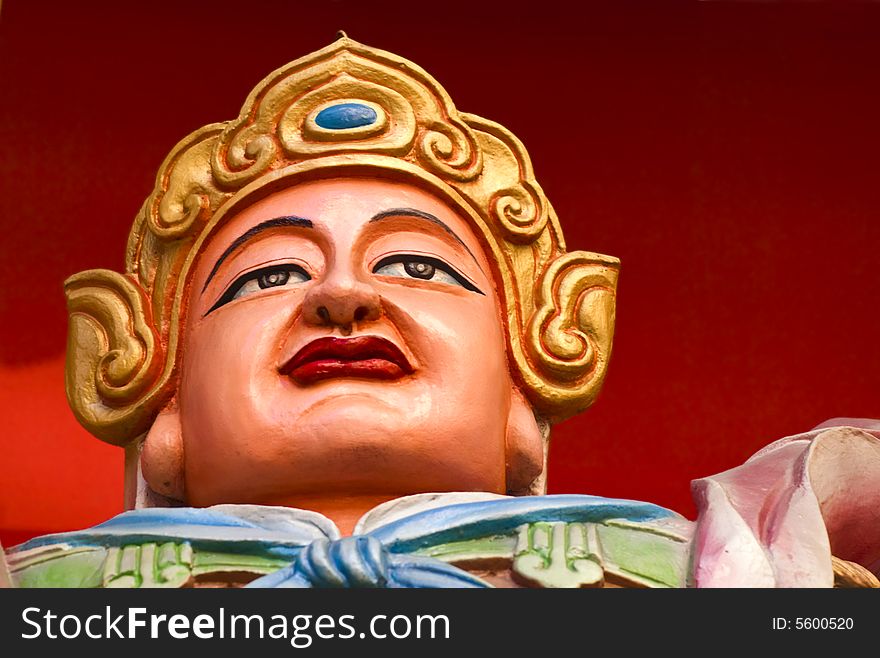 The statue of a Guard at a Buddhist Temple in China. The statue of a Guard at a Buddhist Temple in China