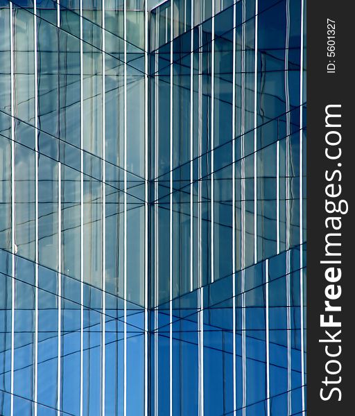 Business building, blue glass, clouded sky reflections. Business building, blue glass, clouded sky reflections