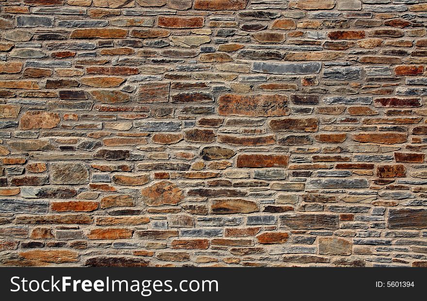 Stone wall of a mediterranean town, background texture