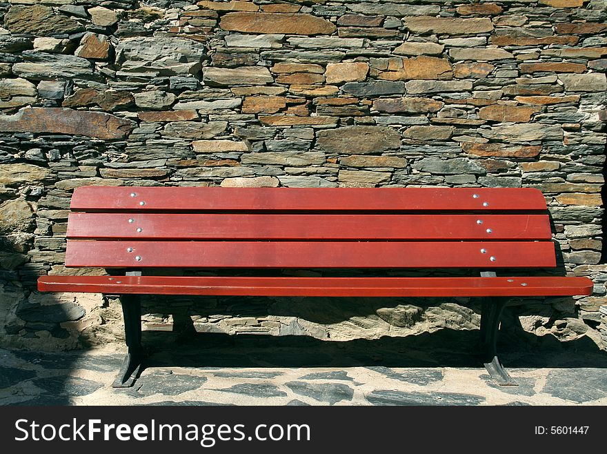 Stone wall, red bank, stone floor, relax on a sunny day. Stone wall, red bank, stone floor, relax on a sunny day