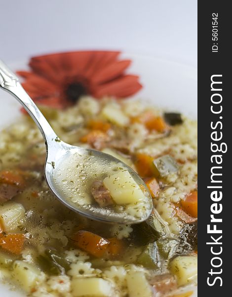 Soup and spoon in cymbal