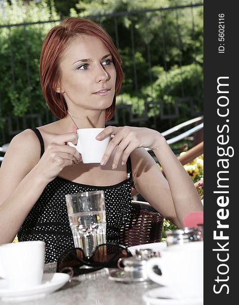 Young girl in open-air caffee. Young girl in open-air caffee