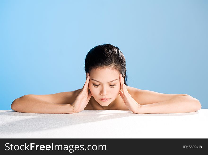 Young Woman With Both Hands On Her Forehead