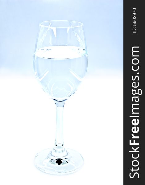 translucent glass of wine with the liquid on a white background. translucent glass of wine with the liquid on a white background