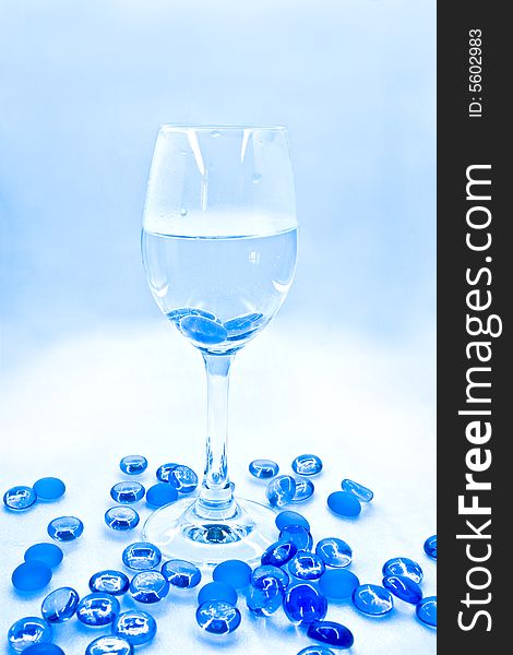 wine Goblet with blue glass balls. Abstraction. wine Goblet with blue glass balls. Abstraction