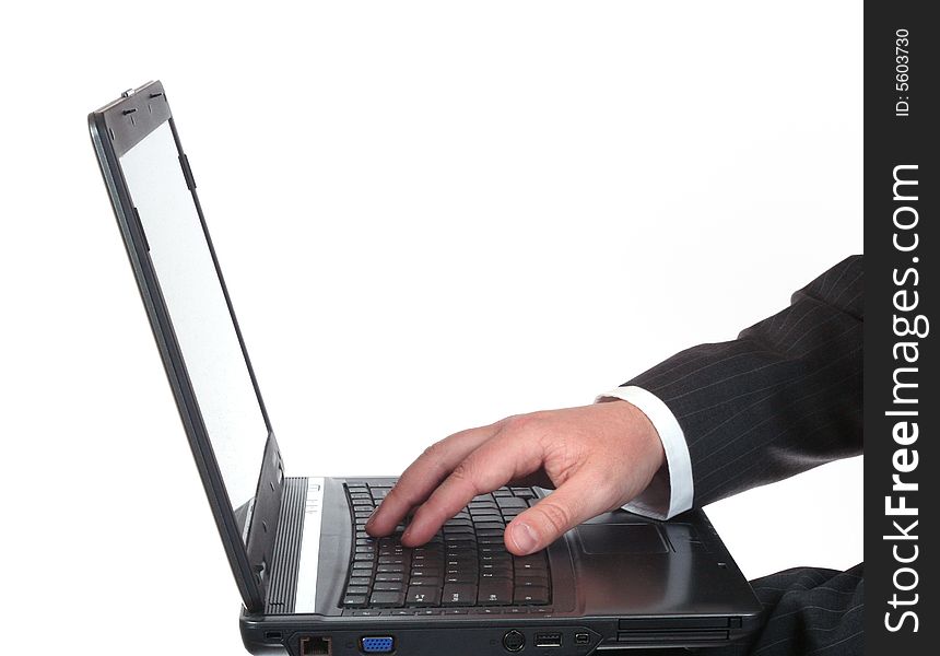 Man's hand on a laptop isolated on white