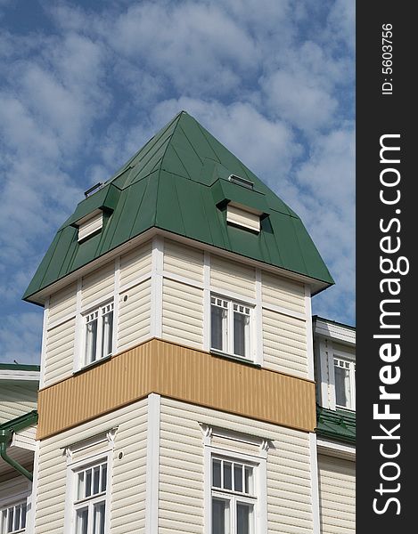 New wooden house with corner tower and