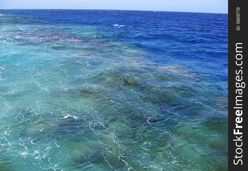Small waves over the barrier coral reef. Small waves over the barrier coral reef