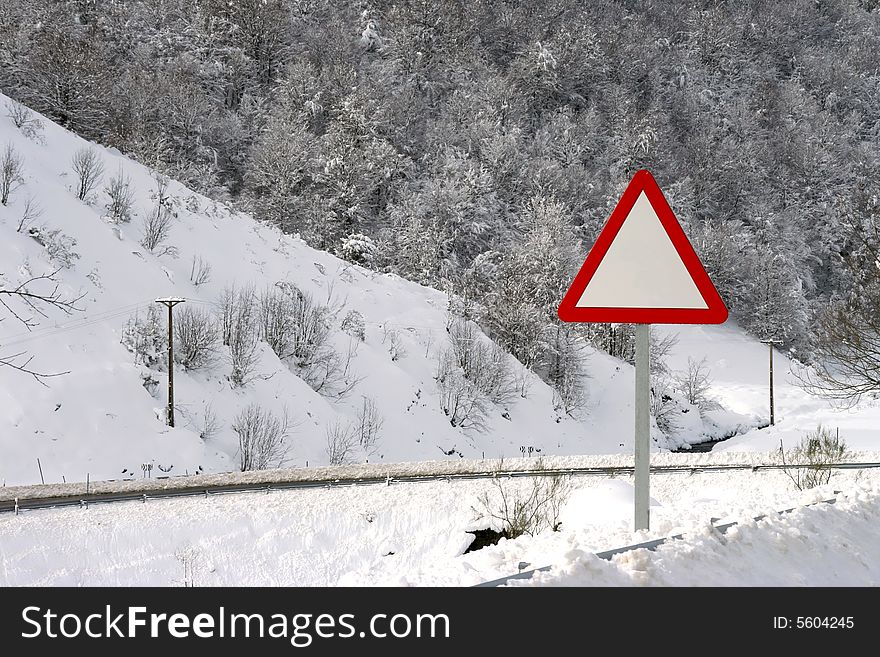 Danger empty traffic signal in snow covered road - winter landscape. Danger empty traffic signal in snow covered road - winter landscape