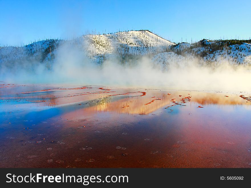 The Grand Prismatic Springs of Yellowstone National Park at sunset. The Grand Prismatic Springs of Yellowstone National Park at sunset.