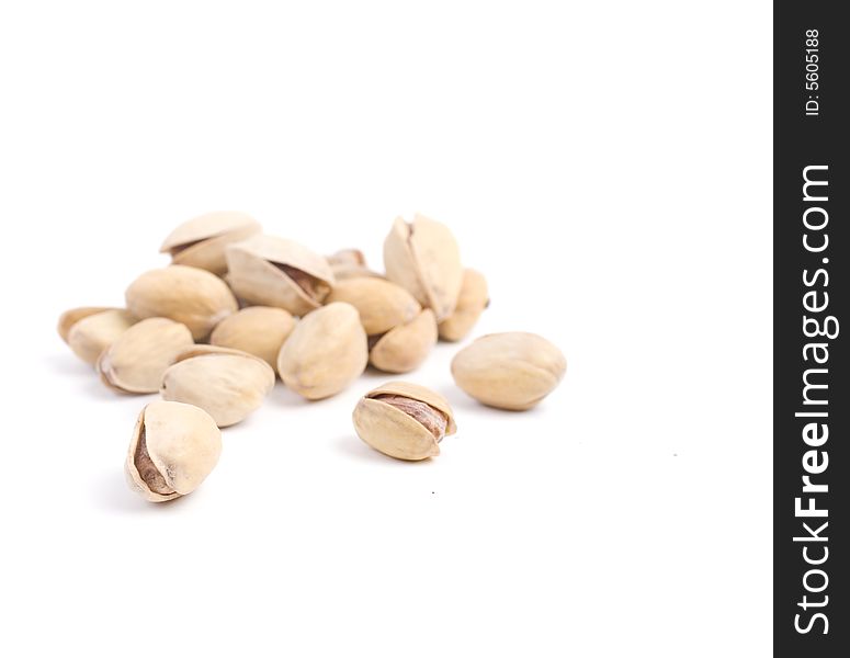 Solted pistachio nut at white isolated background