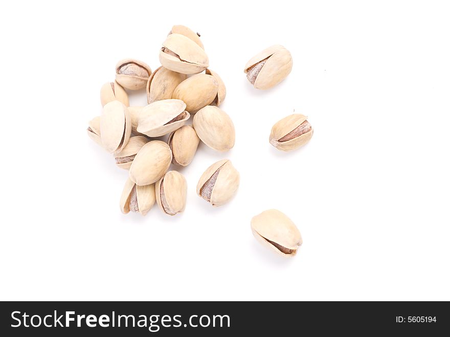 Solted pistachio nut at white isolated background