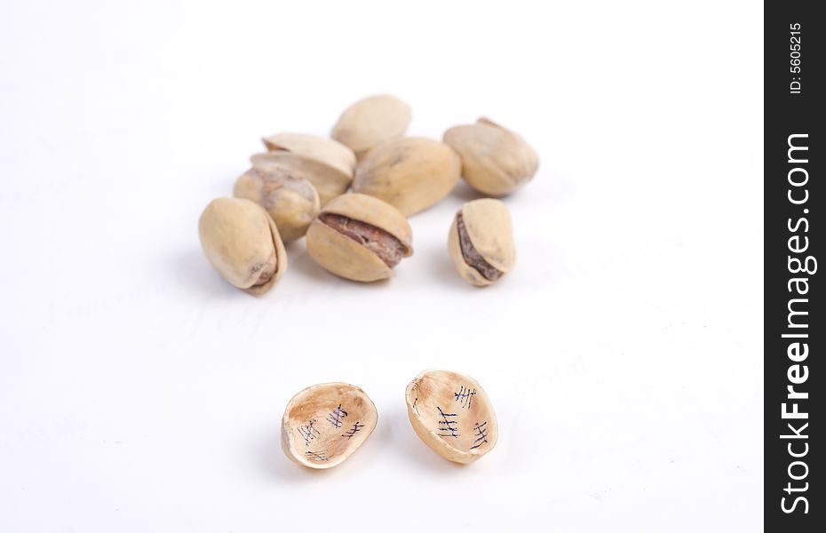 Solted pistachio nut at white isolated background