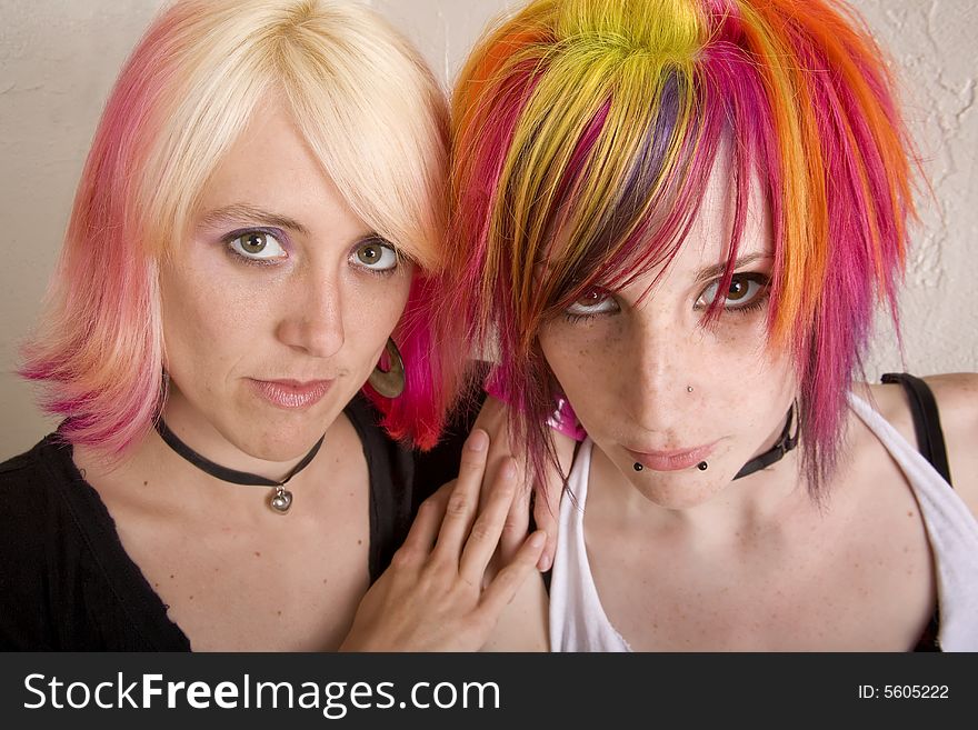 Two hip girls with brightly colored hair. Two hip girls with brightly colored hair