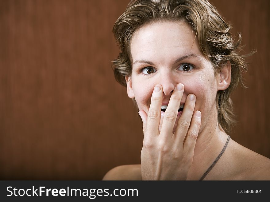 Portrait of a surprised woman in a studio setting