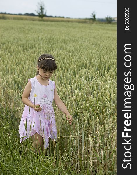 Baby Farmer Holding Grain