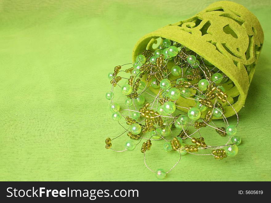 Green beads on wire in a soft container