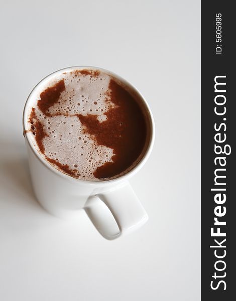 One white coffee cup with hot chocolate, shallow DOF