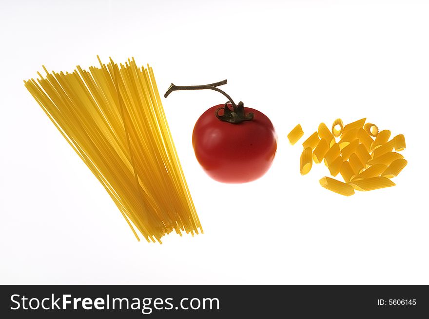 A shoot of pasta and tomato on withe background
