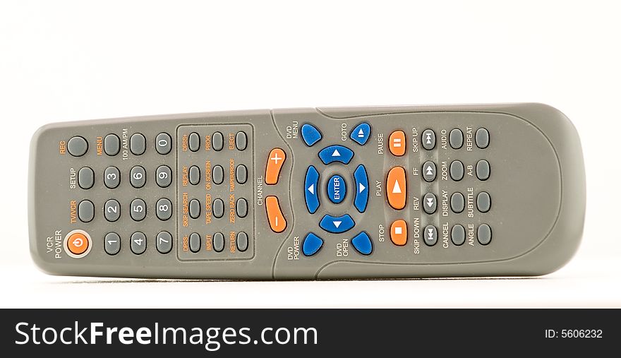 An isolated blue and orange remote control on white. An isolated blue and orange remote control on white.