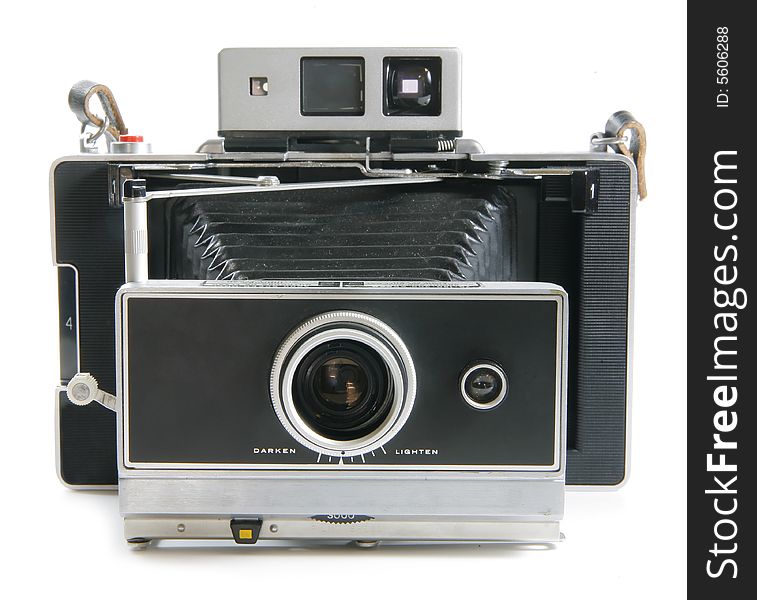 A old vintage land camera with bellows extended isolated on white