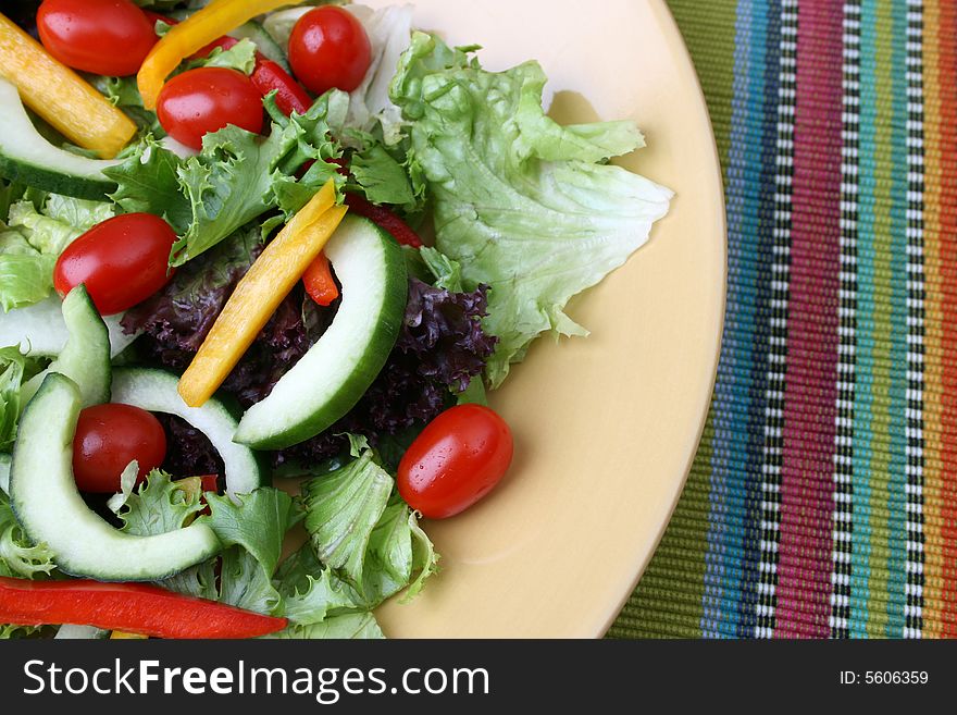 Fresh colorful salad with cherries tomatoes and cucumber