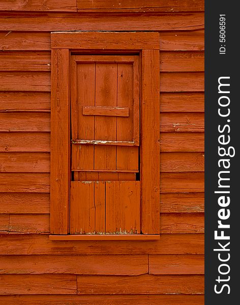 Bright red wooden window and wooden siding. Bright red wooden window and wooden siding.