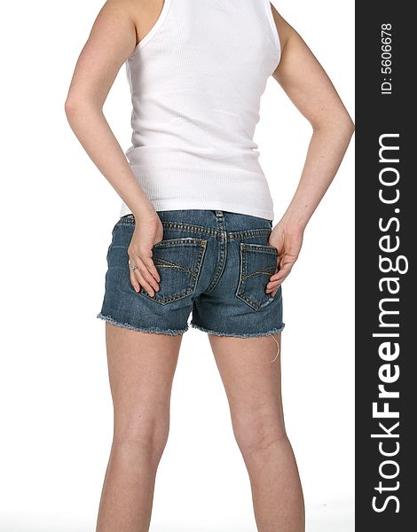 Rear view of teen with hands in shorts pockets. Rear view of teen with hands in shorts pockets