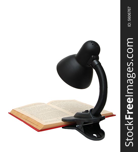 Desk lamp and the book isolated on a white background