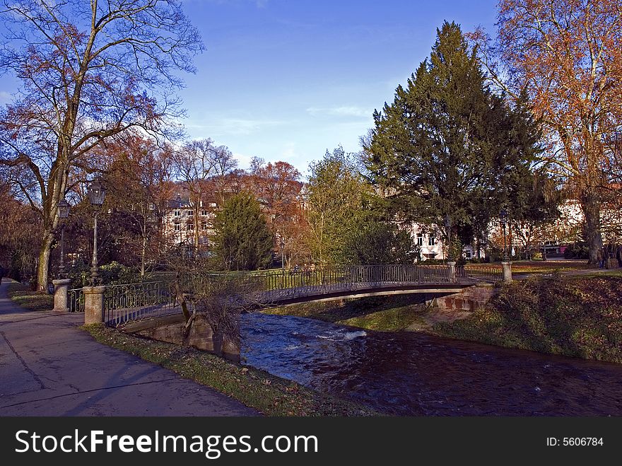 Late autumn in city. The small river crosses a park. Late autumn in city. The small river crosses a park