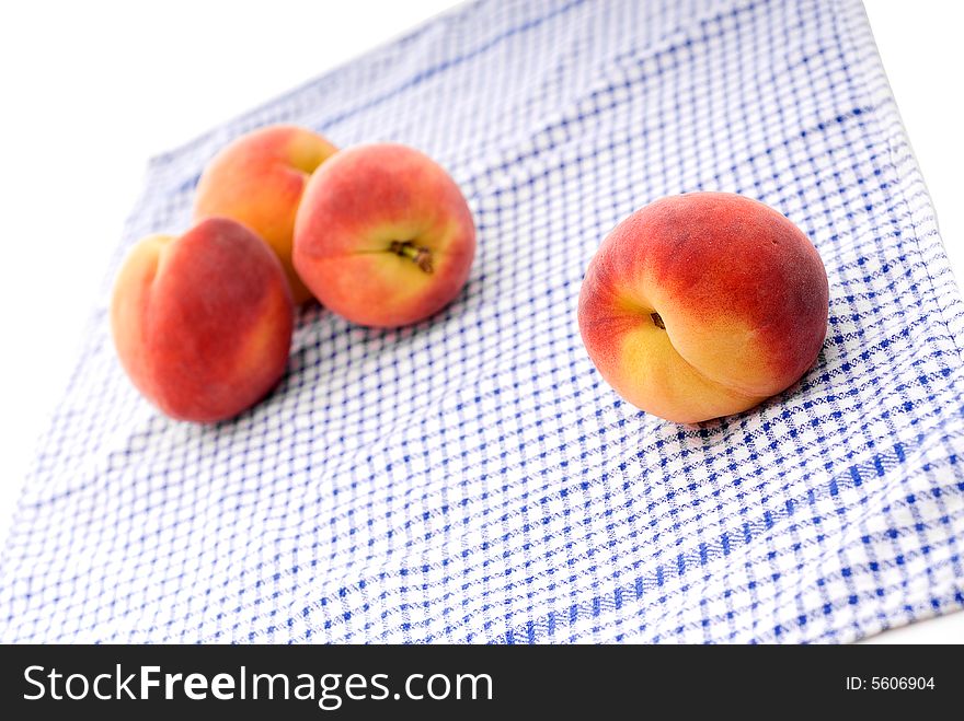 Fresh Peaches On A Kitchen Towel