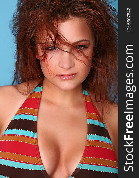 Portrait of Redheaded Bikini Model with Wind Blowing in Her Hair. Portrait of Redheaded Bikini Model with Wind Blowing in Her Hair