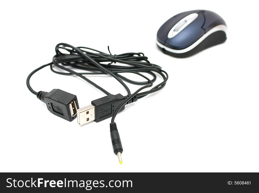 A mouse and USB port cables on white background. A mouse and USB port cables on white background.