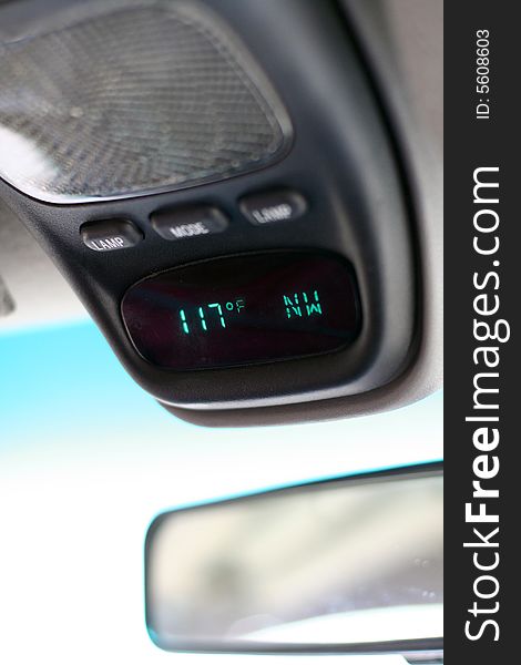 Car temperature gauge showing 117 degrees fahrenheit...a very hot day!  Vertical view. Car temperature gauge showing 117 degrees fahrenheit...a very hot day!  Vertical view.