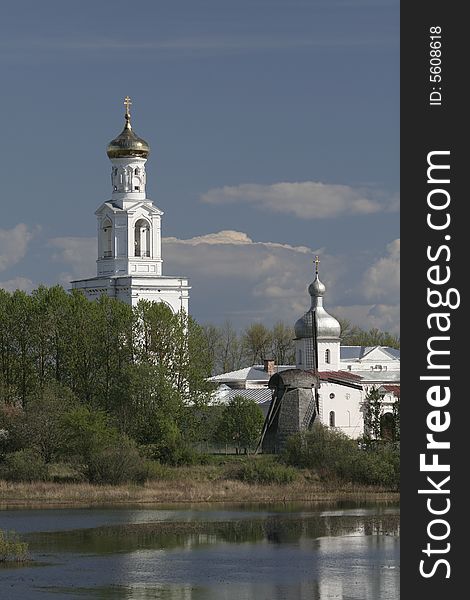 Russia, white church near lake