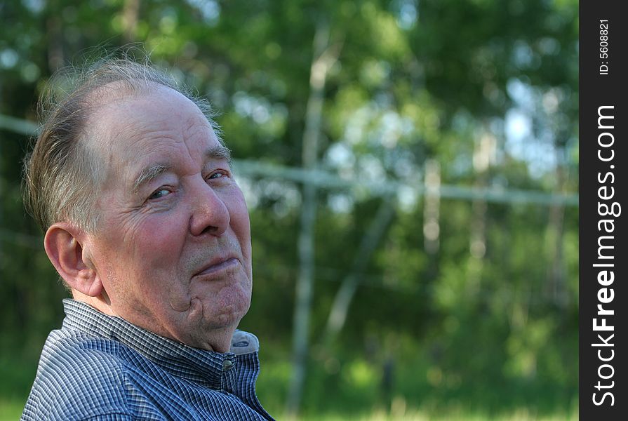 Elderly man enjoying summer outdoors. Elderly man enjoying summer outdoors
