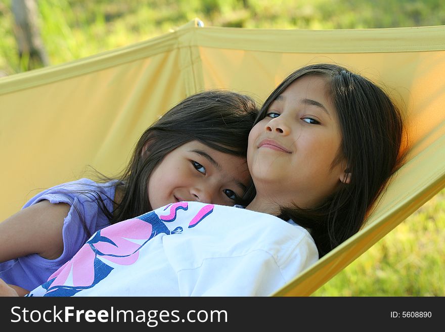 Two girls on a hammock