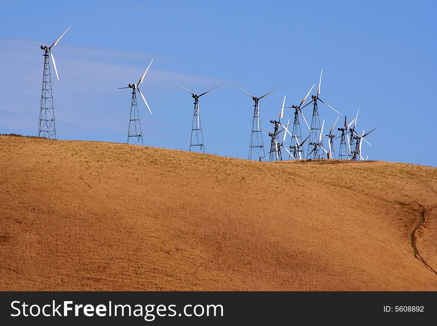 Several wind-driven generators atop a hill in California, USA