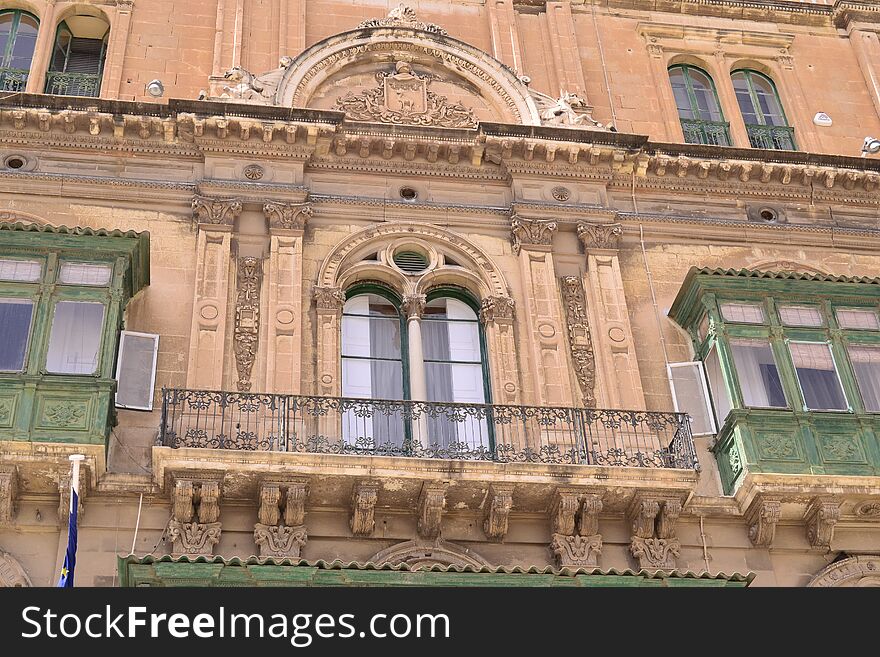 Antique window and balconies of a building in the classical style. Antique window and balconies of a building in the classical style