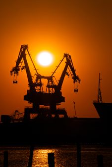Industrial Cranes At Sunset Royalty Free Stock Image Industrial Cranes At Sunset Royalty Free Stock Image