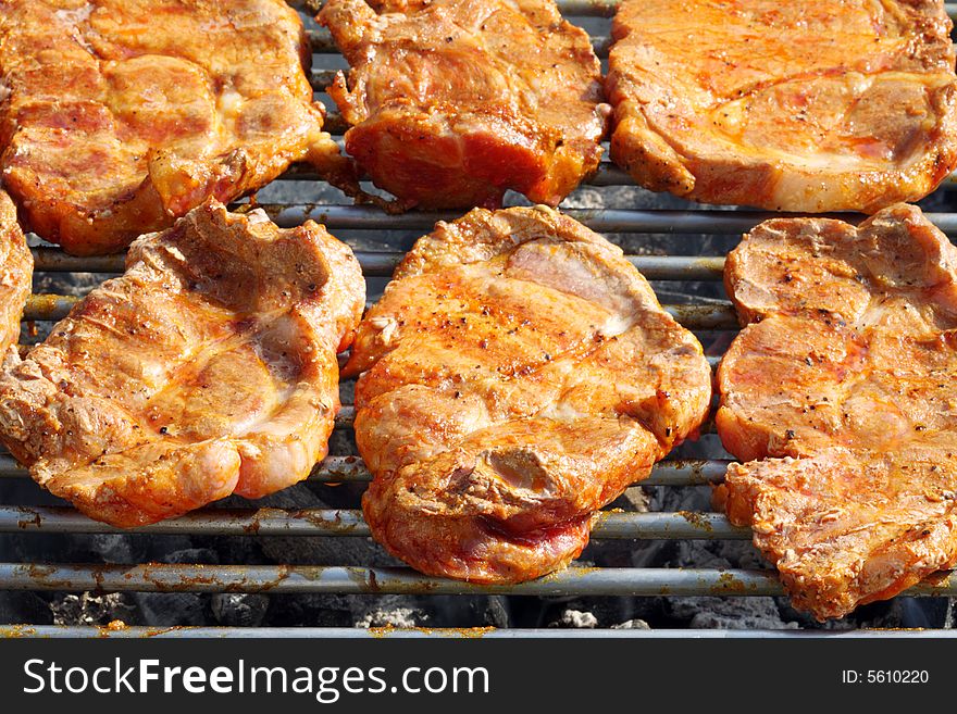 Barbecued steak on the grill. Barbecued steak on the grill.