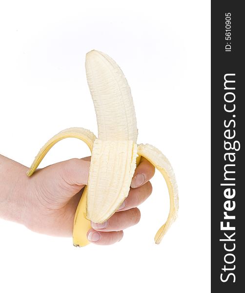 Half peeled banana in hand on white ground