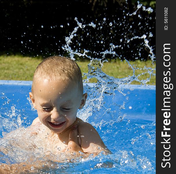 Small boy in swimming pool