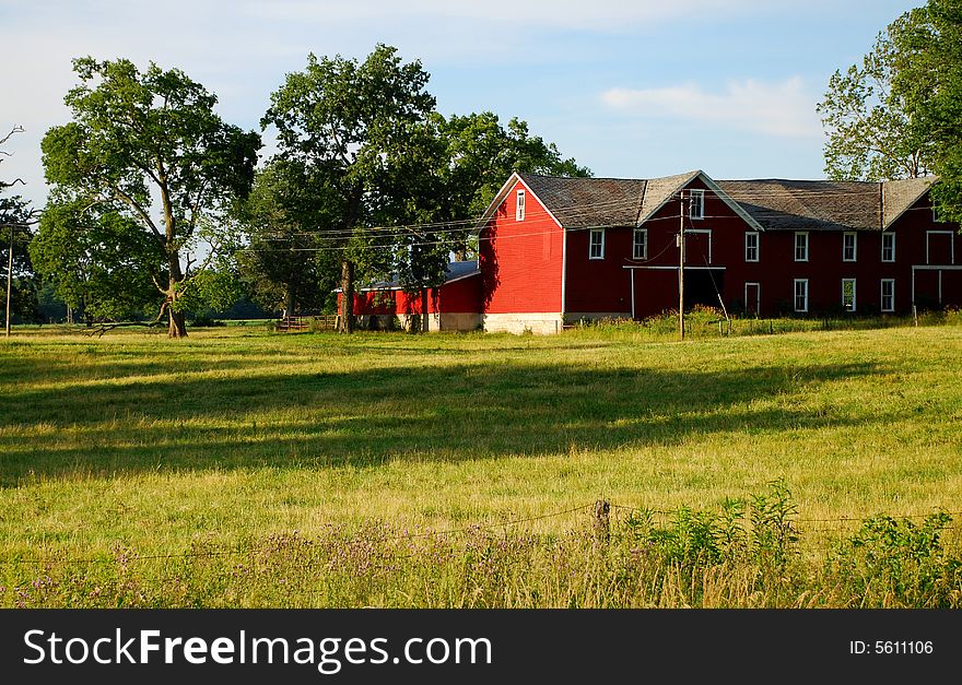 This is a photo of a barn and some of the property around it. This is a photo of a barn and some of the property around it.